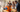 Group of people using a 3D printer in a shared indoor workspace