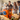 Group of people using a 3D printer in a shared indoor workspace